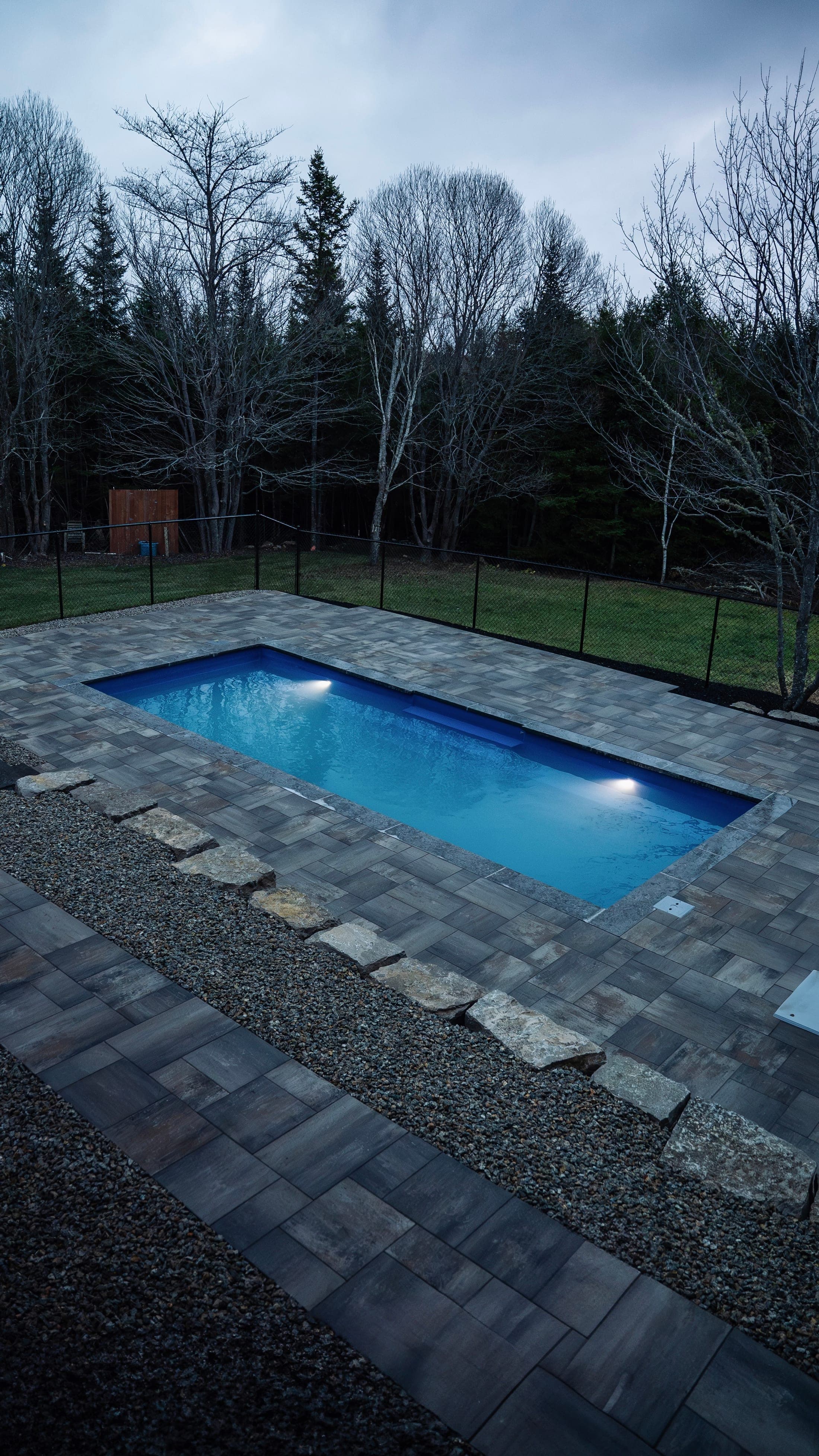 Custom pool installation at dusk