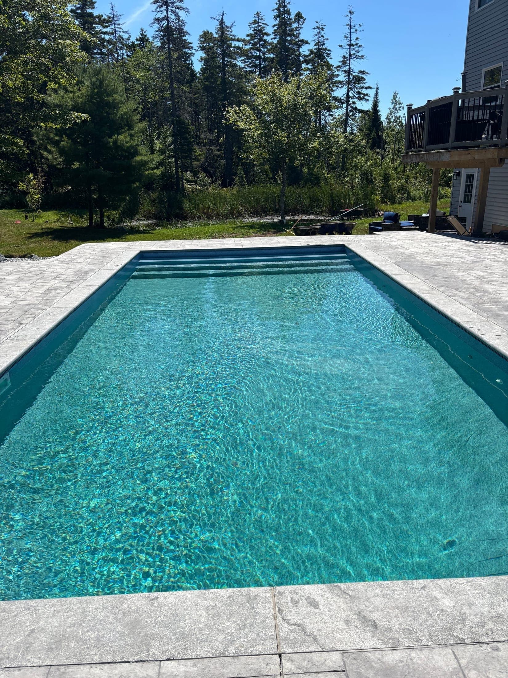 Fiberglass pool with stone coping